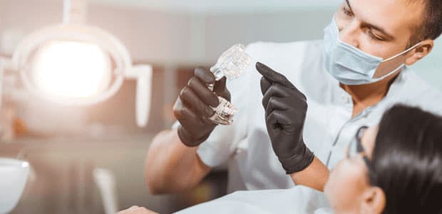 Dentist explaining a dental procedure to a patient