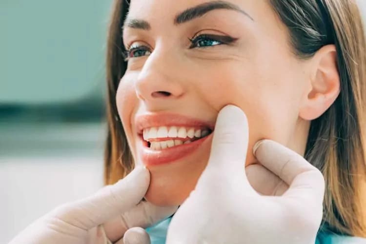 dentist with beautiful female patient B5M9X2W crown dental dublin large 1 750x500