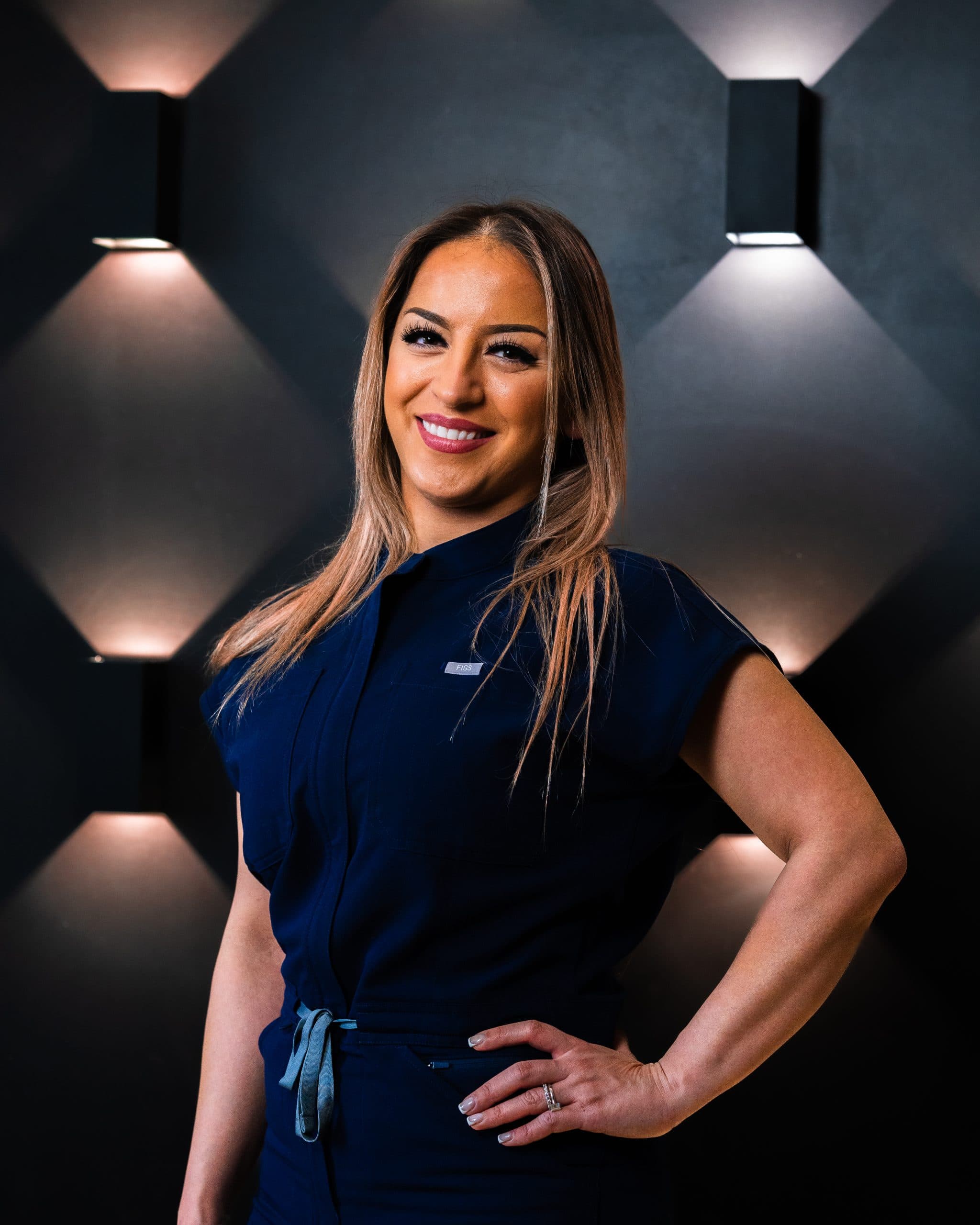 Dentist Dr Elmira Dallali posing with her hand on her hip