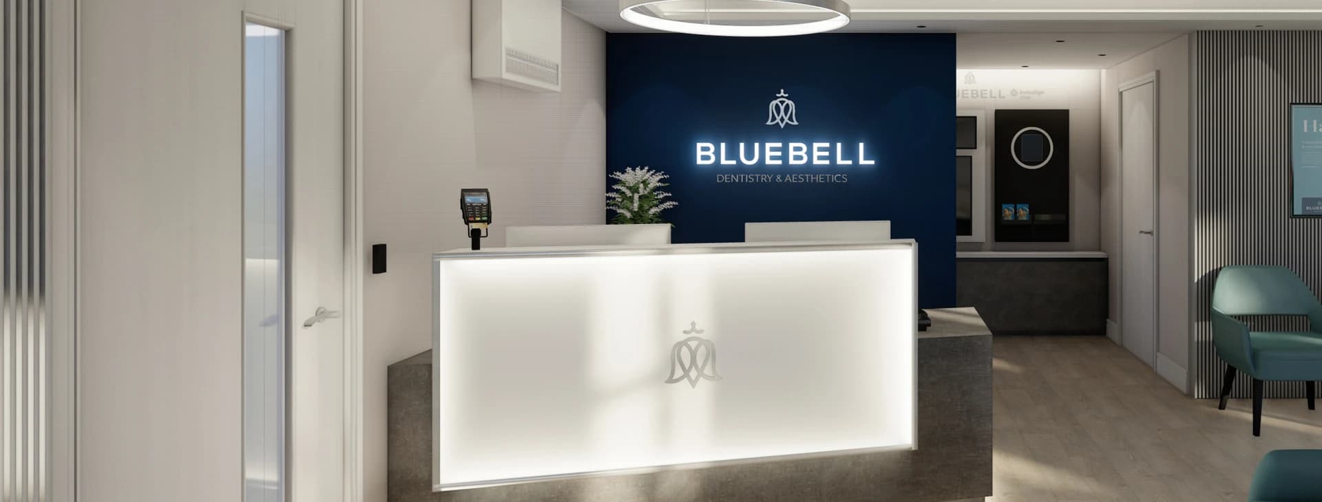 Bluebell Dentistry & Aesthetics reception area with illuminated logo. Modern dental office interior.
