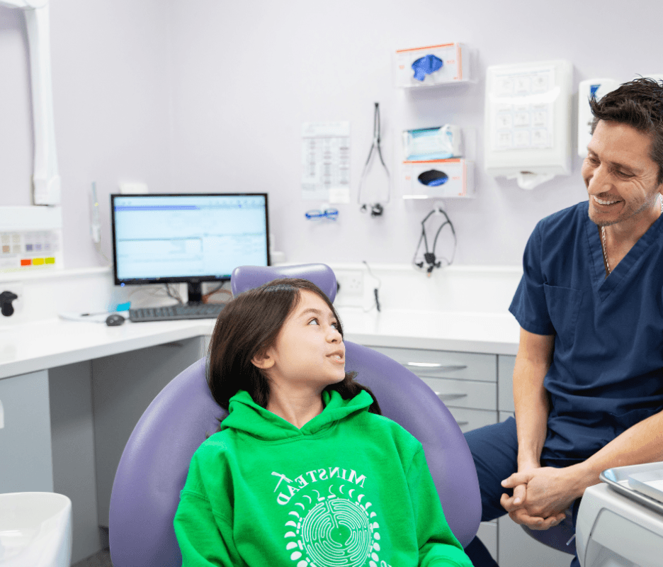 Child looking at dentist