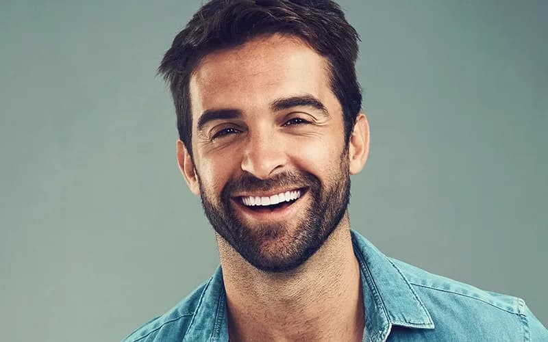 Patient showing a confident, restored smile after dental implant treatment at CrownWood Dental Bracknell